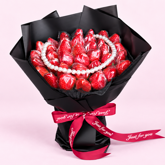 The Strawberry Pearl Bouquet: fresh strawberries with pearl detailing in black wrapping, by Fruitify Dubai
