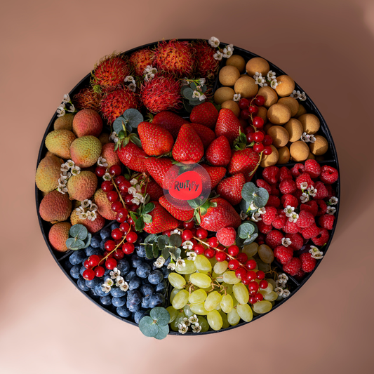 Premium exotic fruit gift box Dubai with fresh seasonal berries, rambutan, lychee and longan