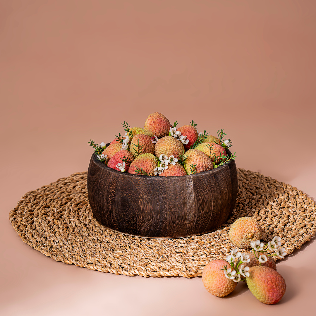 Premium lychee fruit bowl filled with fresh juicy lychees in an elegant wooden bowl, beautifully presented for luxury healthy gifting in Dubai
