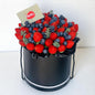 Black box filled with strawberries and blueberries, branded 'Fruity'.