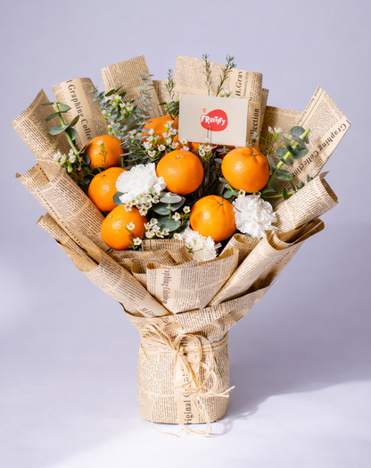 Citrus Blossom fruit and flower bouquet with fresh mandarins, carnations, gypsophila and eucalyptus for gifting in Dubai by Fruitify.