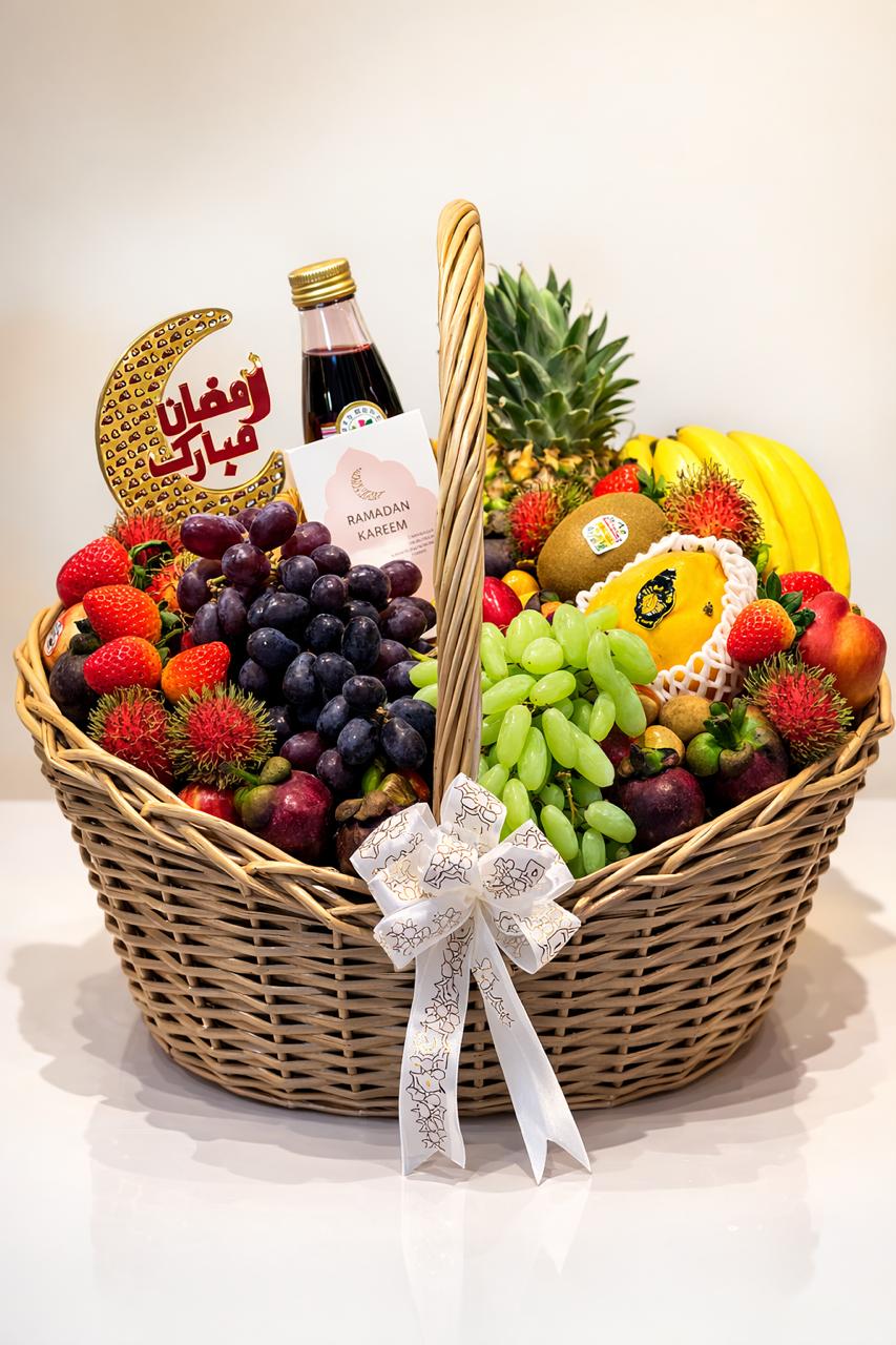 Fruit basket with a bottle of wine, decorated with a decorative crescent moon and star, on a white background.