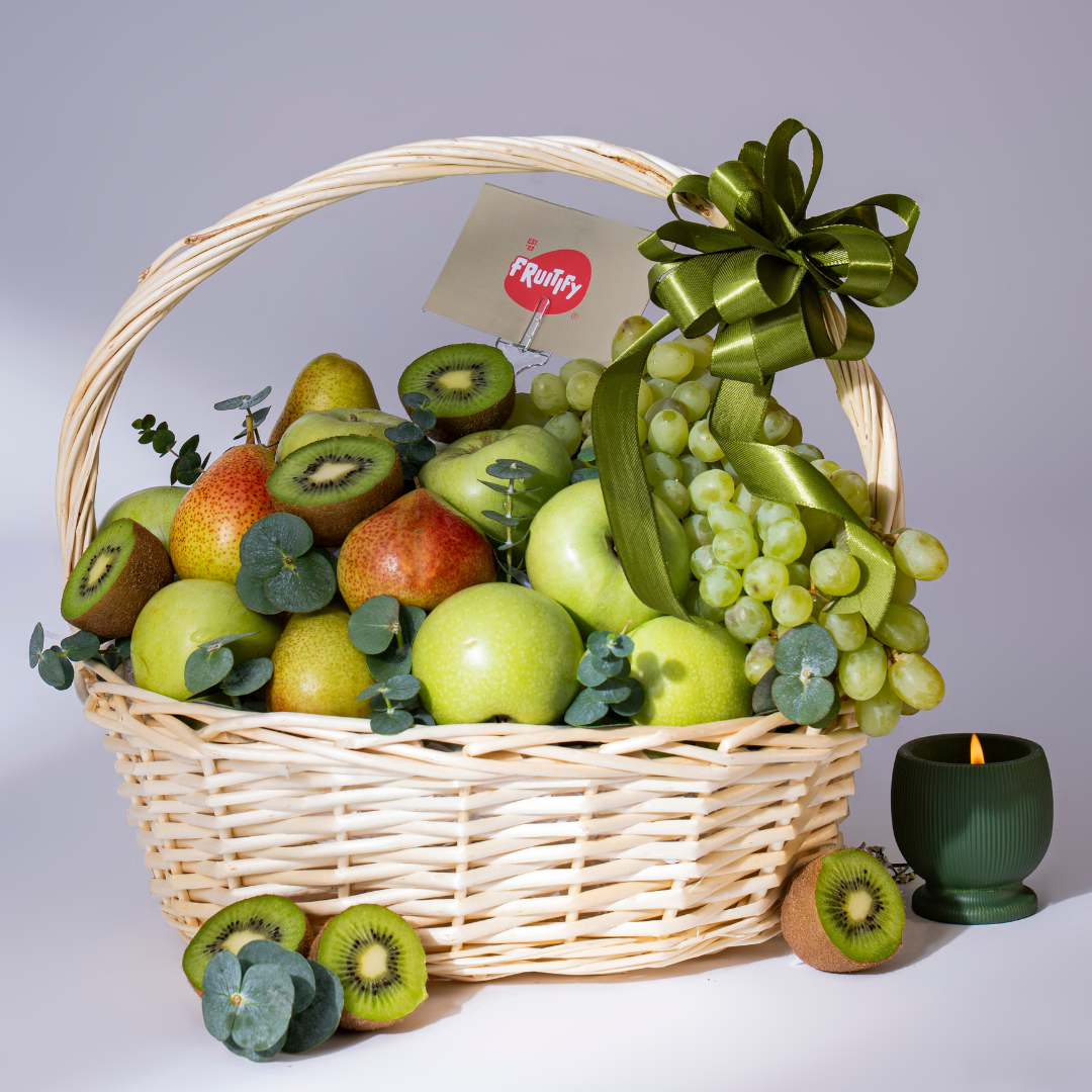 Premium green fruit basket featuring green apples, pears, kiwi, grapes, and seasonal fruits in an elegant wicker basket, perfect for healthy gifting and same-day delivery in Dubai